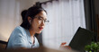 © Johnstocker - Portrait of Female freelancer sitting at desk wear wireless headphones having video call to explain work to coworkers via digital tablet in home office. Working from home
