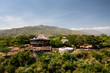 © AmazingAerialAgency - Aerial view of picturesque Shecha Kuteba Houses surrounded by lush greenery and mountains, Southern Nations Nationalities and Peoples' Region, Ethiopia.