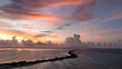 © AmazingAerialAgency - Aerial view of serene sunset over tranquil ocean with beautiful clouds and vibrant reef, Bonaire, Caribbean Netherlands.