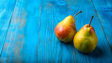 Two ripe pears on a vibrant blue table, creating a simple yet striking still life composition, ripe, pears, vibrant, blue