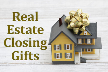 Sticker - Real Estate Closing Gift with a house with a bow on a desk