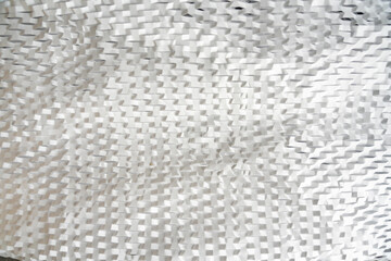 Texture of many layers of corrugated white paper for safe transportation, in which the goods brought by the courier delivery service are wrapped, environmental packaging concept. Eco background