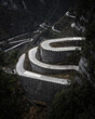 © Amazing Aerial - Aerial view of winding road meandering through majestic mountains and cliffs, Zhangjiajie, China.