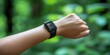 © kwanchaift - A fitness tracker worn on the wrist, showing real-time statistics on physical activity and health, with a focus on the integration of wearable technology into daily life.