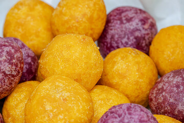 Yellow and purple round fried potato snacks