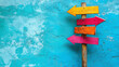 © Екатерина Чумаченко - Wooden post with vibrant directional signs against a blue background, symbolizing choices, directions, and decision-making