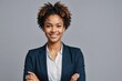© ThomasLENNE - portrait of smiling young multiethnic woman looking at camera with crossed arms