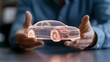 © nuengneng - A person holds a holographic model of a car, showcasing advanced technology and design innovation in the automotive industry.