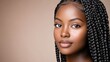 © lililia - A serene portrait showcases an African American woman with long box braids and radiant skin, illuminated to reveal the elegance of her facial features
