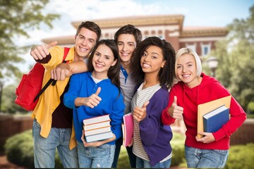 Wall Mural - Group of happy young students at campus together