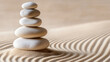 © MarkFinal - A serene zen garden featuring stack of smooth stones on gently rippled sand, creating tranquil atmosphere that promotes relaxation and mindfulness