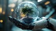 © Reyhan - A robotic hand holding a glass sphere with a tree inside