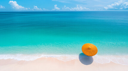 A stunning beach scene with a vibrant yellow umbrella on the soft white sand, and crystal clear turquoise waters under a blue sky.