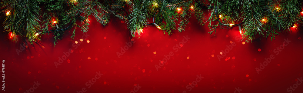 Christmas fir branches on glittering red background with winter holiday ...