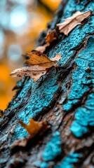 Wall Mural -  A tight shot of a tree trunk, adorned with a single leaf atop, and painted blue