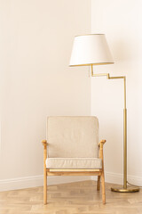 Stylish floor lamp with a chair in the interior. Interior and style concept.