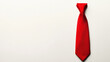 © Elmin - A red tie against a plain white backdrop.