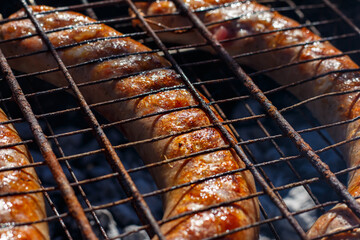 Sausages are fried on the grill