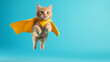 © Andres Mejia - Ginger cat superhero wearing yellow cape flying through air