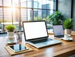 © Achiraya - Modern workplace setup featuring blank screens on laptop and mobile phone, surrounded by office supplies, with ample space for advertising text or design creative work.