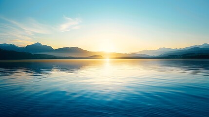 Sunrise over a calm lake with mountains in the distance, soft sunlight reflecting off the water and creating a serene ambiance.