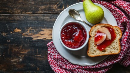 Fresh homemade pear jam on breakfast bread with pear fruit