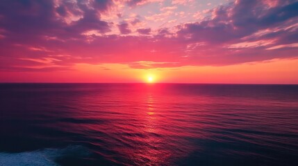 Poster - The sky is a beautiful shade of pink and orange, and the ocean is calm