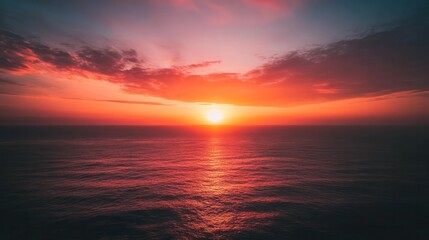 Poster - A beautiful sunset over the ocean with a bright orange sun
