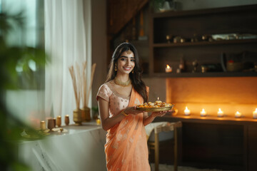 Poster - young indian woman celebrating diwali festival at home