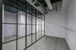 © alhim - Modern design of office space in loft style with glass partitions. Working floor in the .corporate sector. Unfurnished.