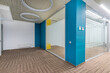 © alhim - Bright office corridor with original ceiling and floor decor. Offices with glass partitions.