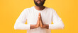 © Prostock-studio - Cropped of black man holding hands in praying gesture, panorama
