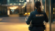 © Michael - Woman security officer is conducting a nighttime patrol to safeguard an office building