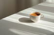 © Jakub - White coffee cup on minimalist table