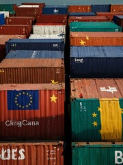 Sticker - Sea containers marked with China and EU flags represent trade tensions.