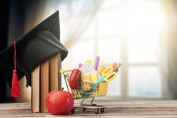 Wall Mural - Classroom setting: school supplies placed on desk.