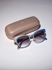 Stylish rectangular sunglasses case with fashionable sunglasses on clean surface. Generative AI