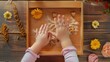 © LukaszDesign - Montessori school sensory box teaching concept with child s hands from above