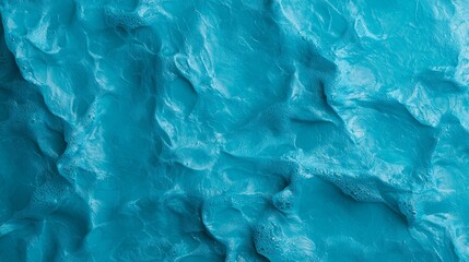  A tight shot of a blue wall with water-like ripples, and a plane positioned centrally in the frame