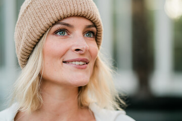 portraits of nice looking blonde girl with hat in scandinavia