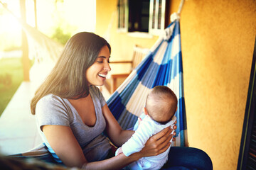 Poster - Happy, woman and holding baby outdoor for playful bonding, family security and communication at house. Smile, mother and newborn with sunshine, morning care and safety support for child development