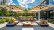 © Elmira - This outdoor meeting space features contemporary couches and tables, complemented by large umbrellas, creating a relaxing atmosphere for gatherings