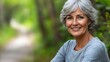 © Neural Pixels - An older woman with gray hair smiles while sitting along a woodland path in a lush green environment