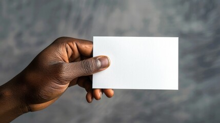 Fototapete - A person is holding a piece of paper, likely with important information or notes