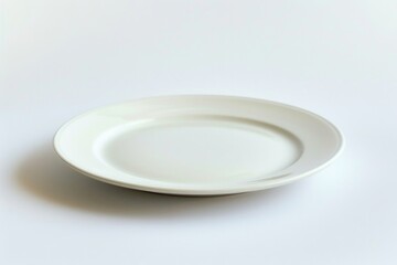 Poster - A single white plate sits on top of a table in a simple setting