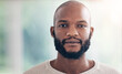 © David/peopleimages.com - Portrait, serious and black man at creative business, startup and career mindset, confident and casual. Professional, entrepreneur and face of African person with company pride, ambition and job
