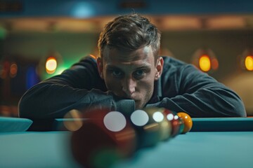 Wall Mural - A person resting on the edge of a billiards table, possibly taking a break or waiting for their turn