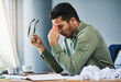 © SensSai/peopleimages.com - Business man, burnout and headache with documents, migraine or red glow with chaos at company. Person, tired and fatigue with pain, mistake or overtime with computer for remote work from home office
