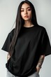 © Dina - Stylish mockup of a plain black oversized t-shirt on a young woman, ideal for branding and design.