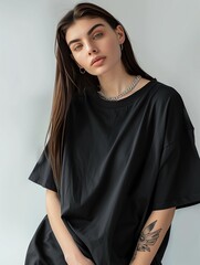 Wall Mural - Mockup of a plain black oversized t-shirt on a young woman, ideal for branding and design